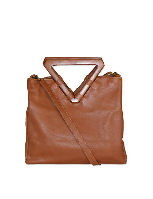 Perfect bag for business and pleasure. Made from soft leather with wooden geometric top handle. Also includes removable shoulder strap.