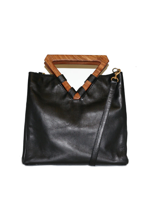 Perfect bag for business and pleasure. Made from leather with wooden geometric top handle. Also includes removable shoulder strap.