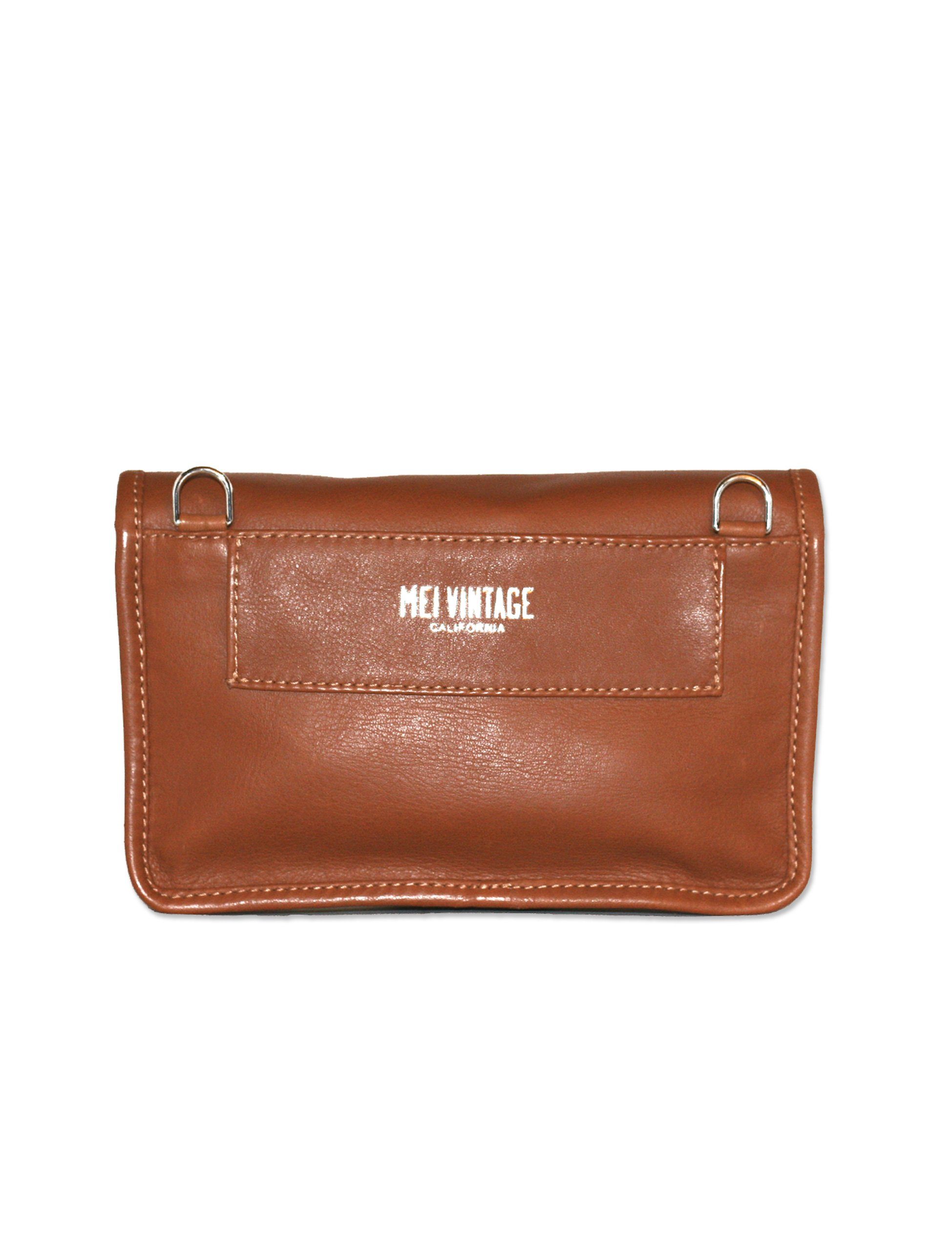 convertible fanny pack in cognac leather. Comes with detachable leather belt strap