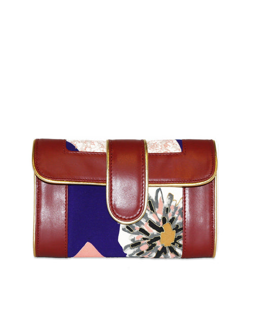 ersatile mini crossbody that easily transforms from day to night. The main fabric features a unique print that was cut from an authentic, vintage kimono of abstract flowers. Handmade mini crossbody is a one-of-a-kind design.