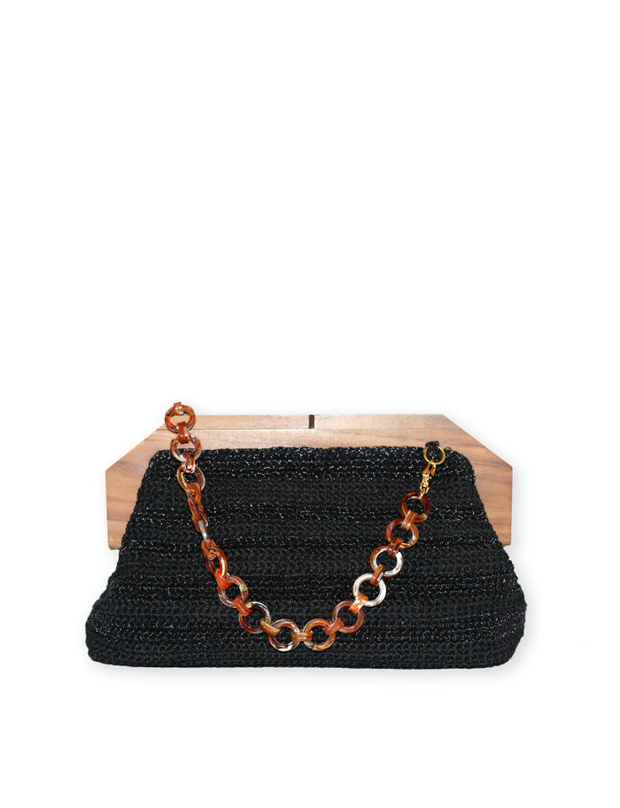 Black woven clutch purse with gold-tone chain necklace and ring clasp, front view